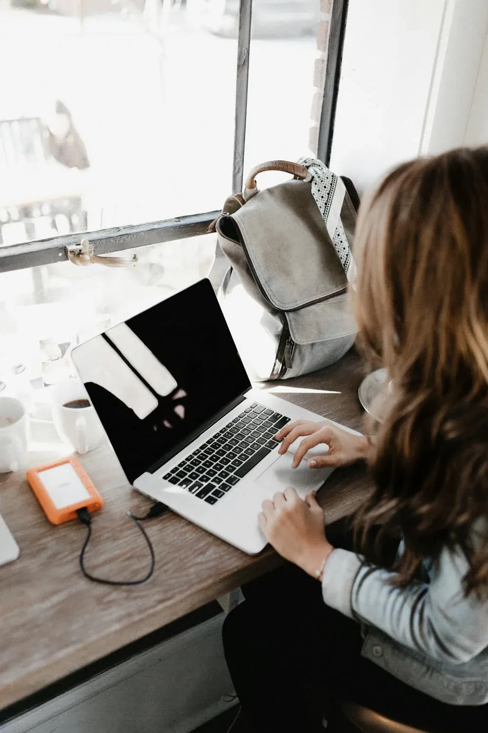 student hunting for an online job on her laptop